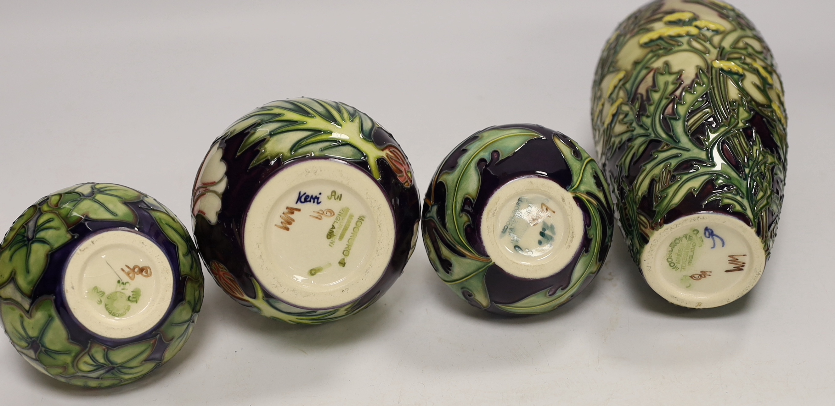 Two squat Moorcroft vases and two larger vases, tallest 19cm high